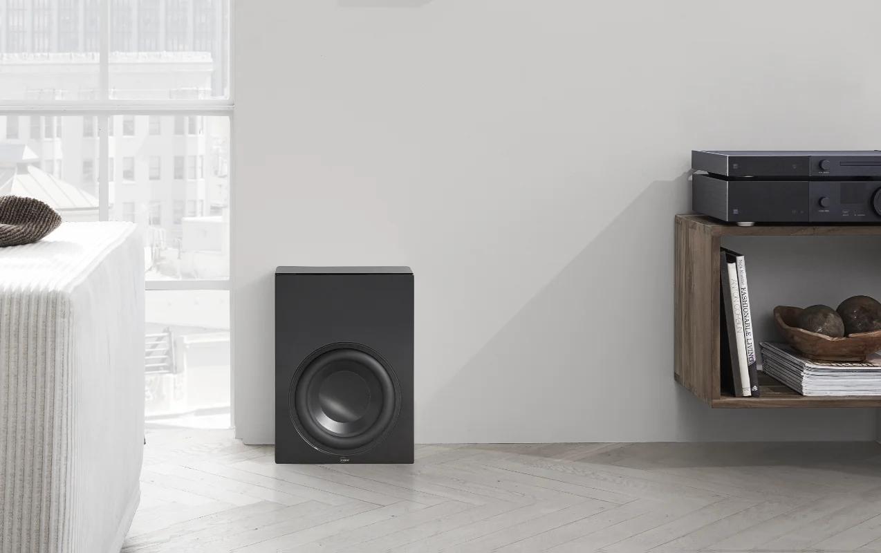 The BW-2 woofer is located near the wall, next to the TDAI-3400 amplifier with a CD-2 player on the shelf