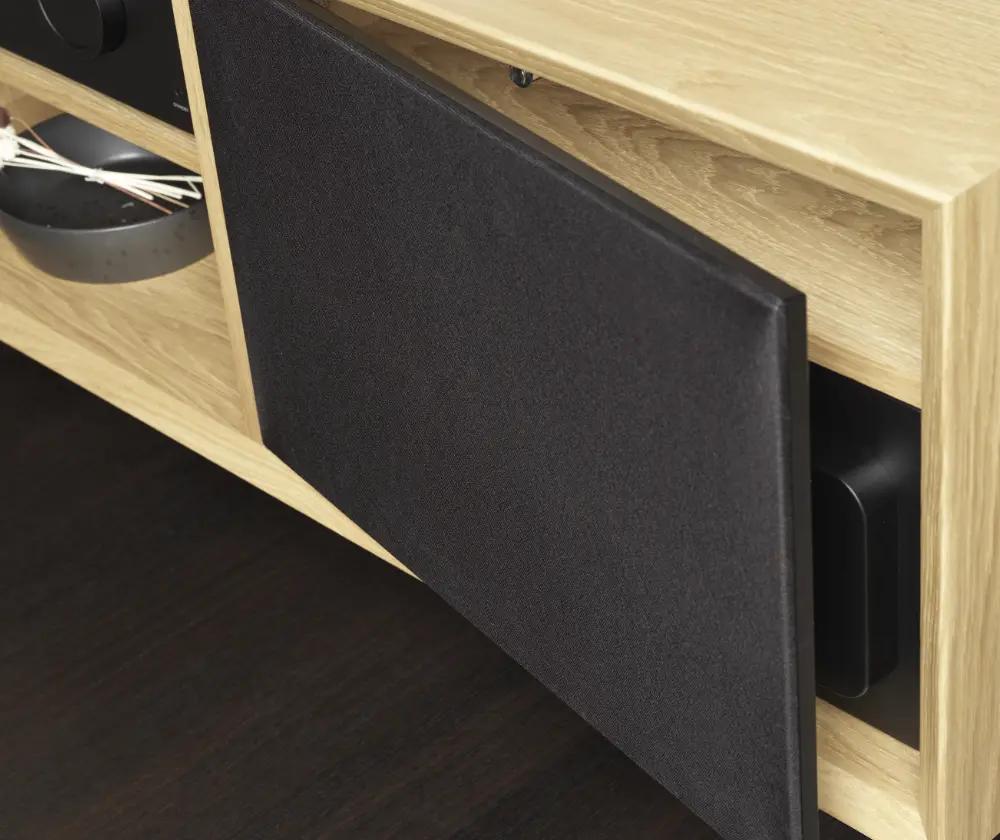 The Lyngdorf CS-1 loudspeaker is placed in a niche in the cabinet behind an acoustically transparent door (slightly open).